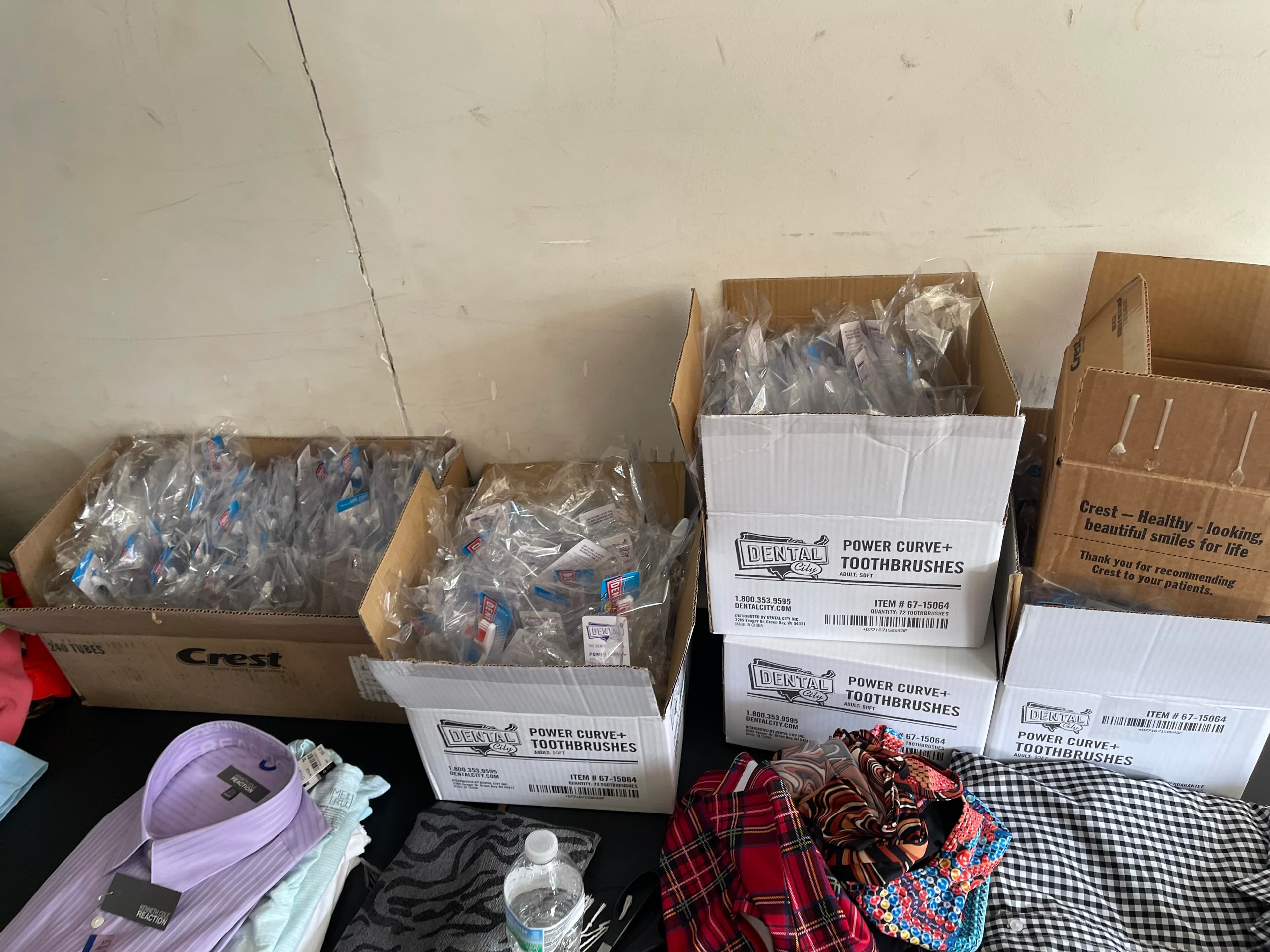 Donated supplies including dental hygiene items and clothing